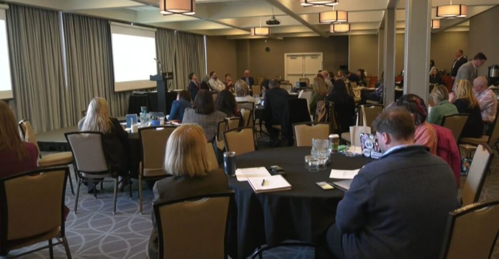 Photo of participants sitting at round tables