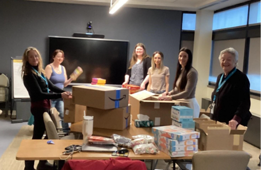 Photo of Hands staff putting together Coping Kits