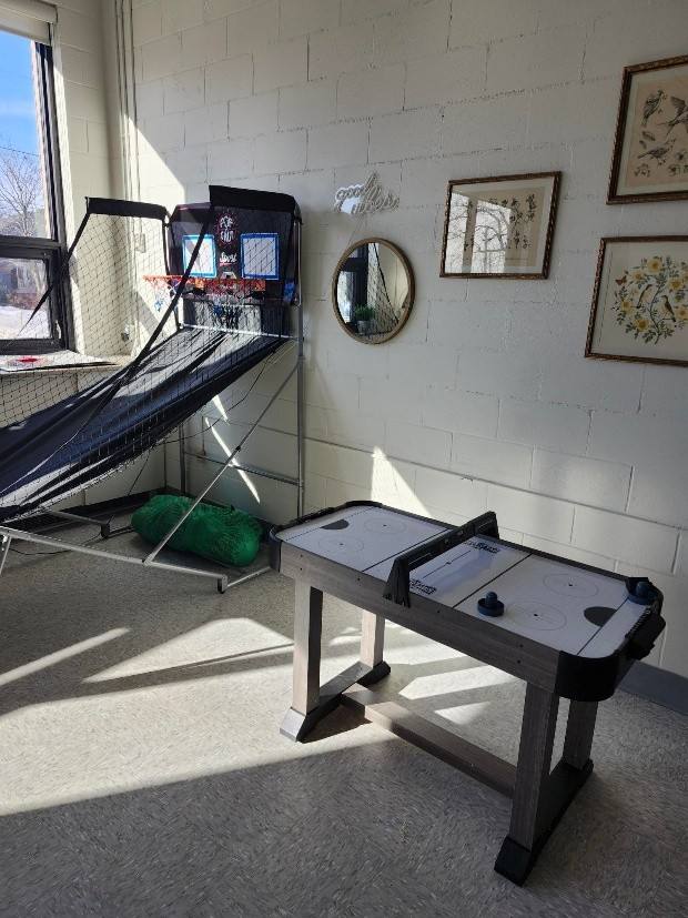 Photo of air hockey table and basketball game