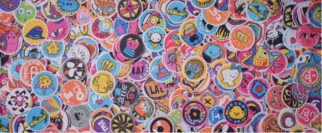 Pile of colourful, circular stickers with characters